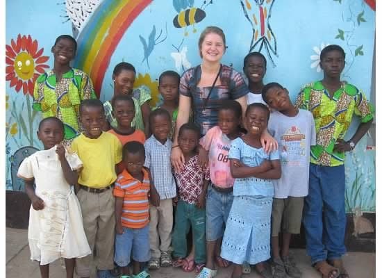 Children and volunteer connected to education support in Ghana